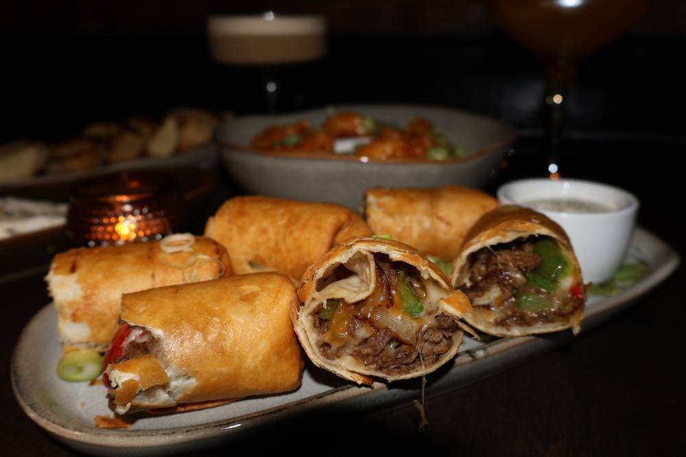 Cheesesteak egg rolls and shareable plates from The Waiting Room's private event menu