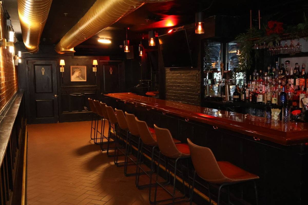 The long bar at The Waiting Room, set up for a semi-private group in Hoboken
